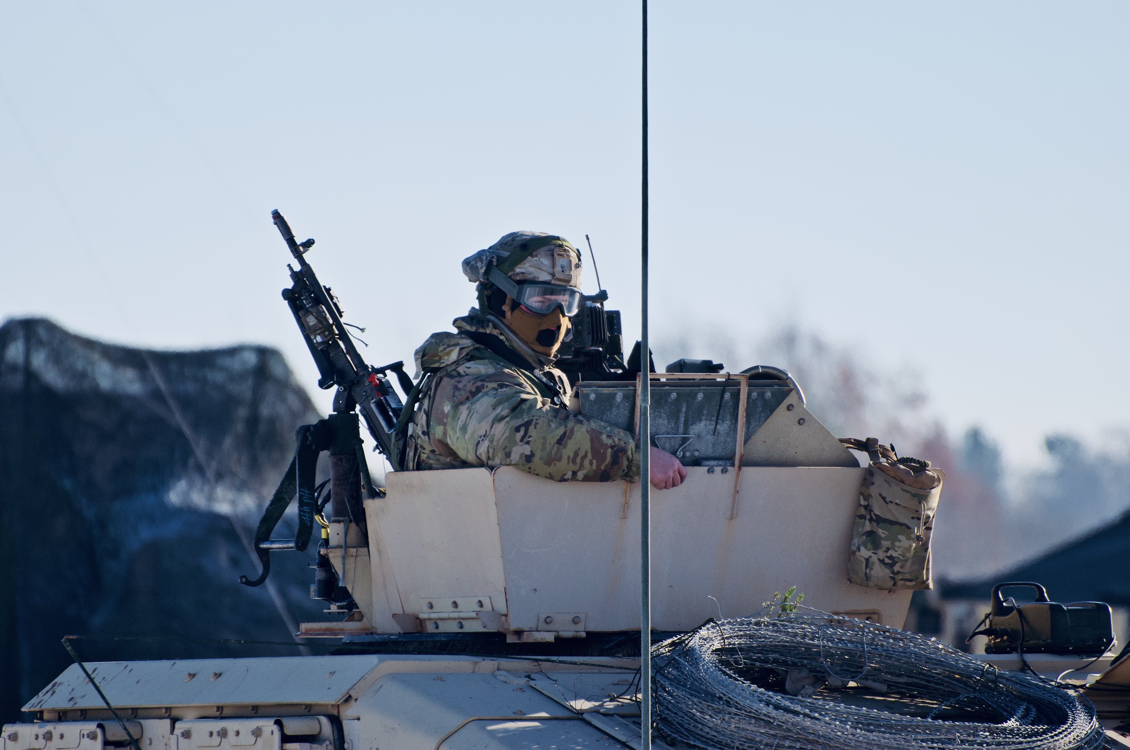 Ryan Yon in U.S. Army uniform, kit on, manning a turret — taken during his six years of active service in the 10th Mountain Division
