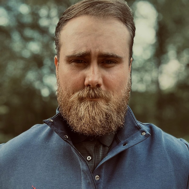 Ryan Yon, founder of NetHarbor, photographed against a forested background